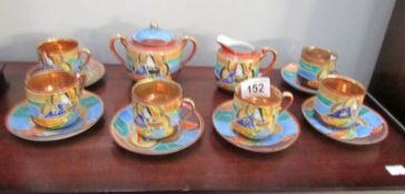 A good quality hand decorated Japanese coffee set with gilded insides