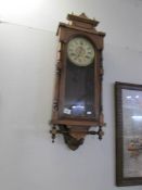 A mahogany wall clock