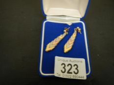 A pair of multi-coloured gold earrings