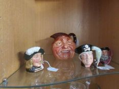 A large Royal Doulton character jug and 3 smaller examples