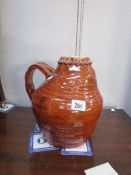 A large stoneware jug decorated with treacle glaze
