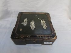 A fine Japanese lacquer box inlaid with ivory figures (some wear to lacquer)