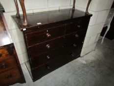 A 2 over 3 stained chest of drawers