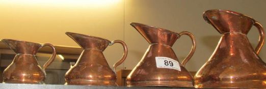 A set of 4 Victorian copper measures