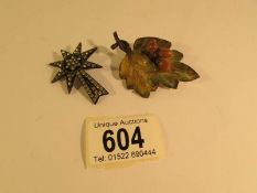 An unusual oak leaf with acorns brooch and one other