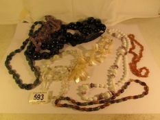 9 vintage necklaces including Amber, Amethyst, Mother of pearl,