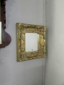 A small gilt framed mirror