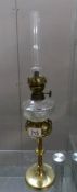 A brass 19th century Gothic church candlestick peg font oil lamp