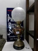 An oil lamp with brass base,