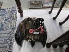 A Beswick spaniel wall plaque