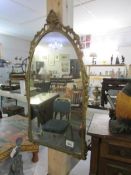 An arched top mirror