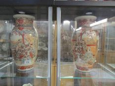 A pair of large hand decorated oriental vases (a/f)