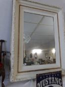 A large shabby chic wall mirror