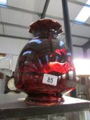 A large ruby glass lampshade