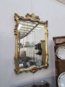 A gilt framed mirror