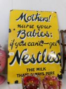 A Nestle 'Mothers Milk' enamel sign