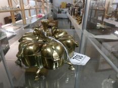 An oriental brass revolving pill box