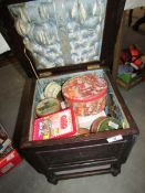 A sewing box and contents