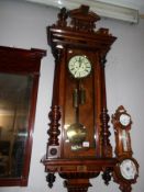 A twin weight mahogany Vienna wall clock