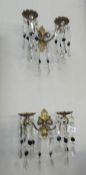 A pair of chandelier style double lamp wall lights