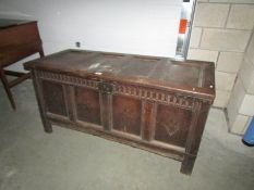 A period oak coffer containing leaded glass panels