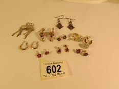 9 pairs of earrings including possibly some gold