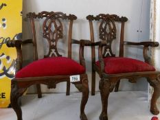 A pair of mahogany dolls Victorian style elbow chairs