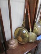 A large copper and brass warming pan,