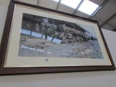 A framed and glazed steam train print