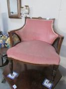 An Edwardian mahogany inlaid tub chair