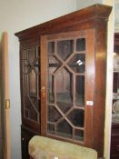 A Victorian astragal glazed corner cabinet