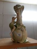 A Royal Dux vase surmounted female figure