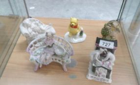 A Royal Doulton Winnie the Pooh, a Royal Albert Mr Ptolemy, A Victorian figurine of girl on bench,