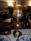 A brass oil lamp converted to electric