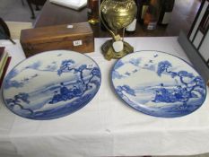 A pair of large Japanese blue and white charges, marks to backs,