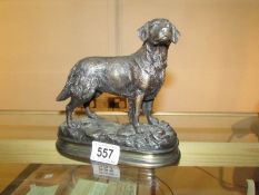 A bronze figure of a retriever