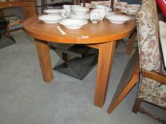A good quality modern dining table with extra leaf