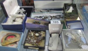 A mixed lot of costume jewellery including brooches, earrings,