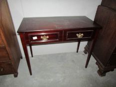 A 2 drawer mahogany side table