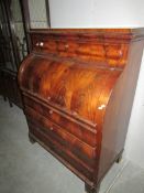 A mahogany barrel top Biedermier secretaire