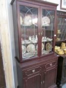 A mahogany glazed top cabinet