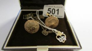 A 9ct gold locket on chain and a pair of cuff links