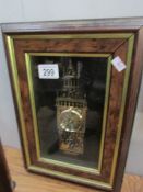 A framed clock in the form of Big Ben