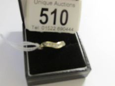 A 9 stone 9ct gold and diamond wishbone ring,