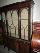 A 19th century mahogany display cabinet