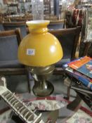 An oil lamp complete with shade