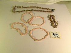 5 pearl bracelets and a necklace