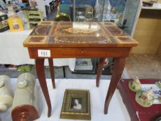 A musical inlaid sewing table