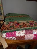 A chenille table cloth and a quilt