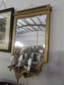 A gilt framed dressing room mirror with built in lights